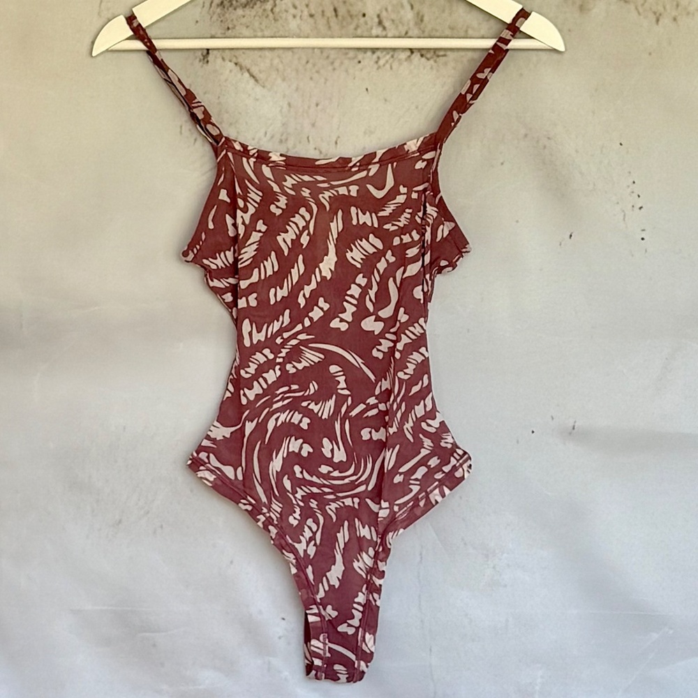 SKIMS Bodysuit in White and Purple